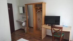 TV a/nebo společenská místnost v ubytování Hotel Mare & Monti