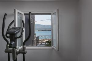 a room with a window and a treadmill at Luxury Villa ARIA, Apartment in Trogir