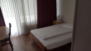 Ein Bett oder Betten in einem Zimmer der Unterkunft Hotel Mare & Monti