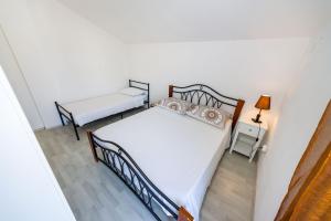 Postel nebo postele na pokoji v ubytování Apartment Juresko