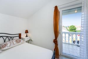 Postel nebo postele na pokoji v ubytování Apartment Juresko