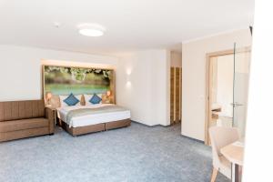 Postelja oz. postelje v sobi nastanitve R&R Residenzen HOTEL