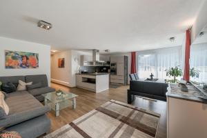 a living room with a couch and a table at Apart Armin in Längenfeld
