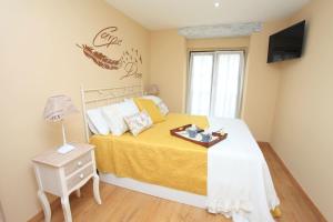 A bed or beds in a room at vivienda vieja cepa