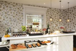 a kitchen with a counter with food on it at Boutique Hotel Des XV in Strasbourg