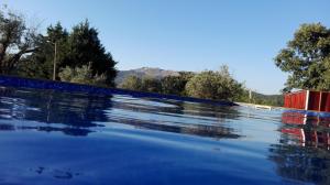 The swimming pool at or near Quinta Do Vaqueirinho - Agro-Turismo