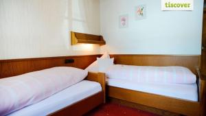 Letto o letti in una camera di Gastehaus Wolf