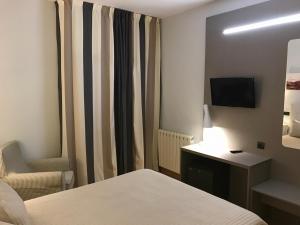 Postel nebo postele na pokoji v ubytování Hotel Valjunco