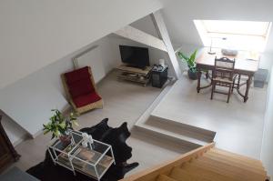 an overhead view of a living room and dining room at upstairs9000 in Ghent