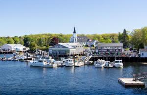 a group of boats docked at a dock in a harbor at Browns Wharf Inn in Boothbay Harbor