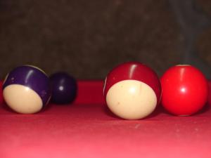 a group of billiard balls on a pool table at Casa d'Aldeia de Souto de Lafões OLIVEIRA DE FRADES in Oliveira de Frades