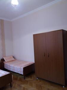 Postel nebo postele na pokoji v ubytování Guest House Lviv Грузия