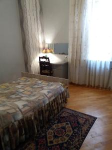 Postel nebo postele na pokoji v ubytování Guest House Lviv Грузия
