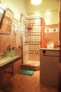a bathroom with a sink and a shower with a sink at B&B Cribò in San Giuliano Terme