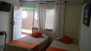 Postel nebo postele na pokoji v ubytování Hotel Napolitano