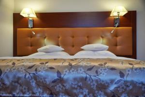 Postel nebo postele na pokoji v ubytování Hotel Wendelstein