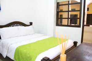 מיטה או מיטות בחדר ב-Hotel Colonial Manizales