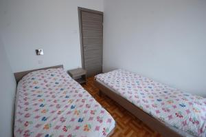 Posteľ alebo postele v izbe v ubytovaní Apartments Jakobi by El-Pi Tours