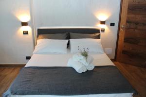 Postel nebo postele na pokoji v ubytování B&B Lo Matsòn