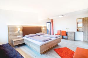 Postel nebo postele na pokoji v ubytování Hotel Sonnenheim