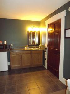 a kitchen with a sink and a counter top at William Watson Hotel in Pittsfield