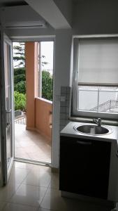 Kuchyň nebo kuchyňský kout v ubytování Apartments Ana