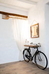 a bike parked in a room with a mirror at Axiotheaton Villas in Pefki Rhodes
