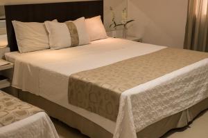 Postel nebo postele na pokoji v ubytování L´acordes Hotel