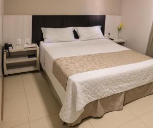 Postel nebo postele na pokoji v ubytování L´acordes Hotel