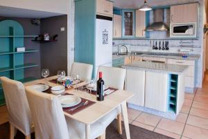 A kitchen or kitchenette at Beachfront apartment in paradise