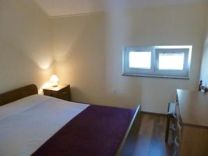 Postel nebo postele na pokoji v ubytování Apartments Vila Lavanda
