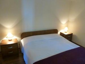 Postel nebo postele na pokoji v ubytování Apartments Vila Lavanda