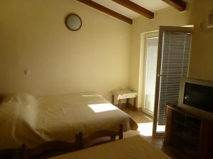 Postel nebo postele na pokoji v ubytování Apartments Vila Lavanda