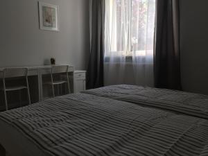 Posteľ alebo postele v izbe v ubytovaní Apartament Warszawska