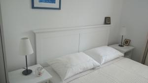 Postel nebo postele na pokoji v ubytování Apartments Ruzica