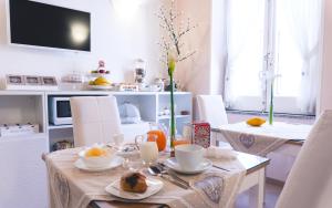 TV a/nebo společenská místnost v ubytování Fata34 Luxury B&B