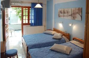 Postel nebo postele na pokoji v ubytování Anais Studios