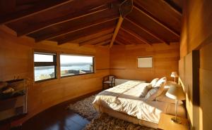 Postel nebo postele na pokoji v ubytování OCIO Territorial Hotel