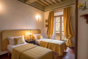 מיטה או מיטות בחדר ב-Residenza Fabroni
