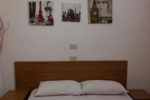 Кровать или кровати в номере Hotel Houston Livorno - Struttura Esclusivamente Turistica - Not for Business or Workers