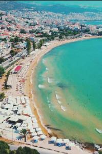 an aerial view of a beach with people and the ocean at Irini Apartments in Kavála