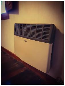 a white wall with an air conditioner on a wall at ETERNO SOL Loft Andino in Humahuaca