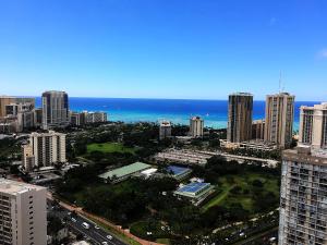 an aerial view of a city with the ocean at Hawaiian Monarch Penthouse 401 by Hawaii Ocean Club in Honolulu