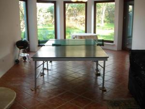 a ping pong table in the middle of a room at 10 os - Gdansk-Sopot-Gdynia up to 19 persons in Gdynia