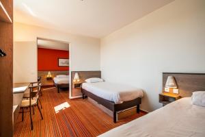 Кровать или кровати в номере Ace Hotel Valence
