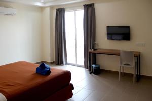 TV a/nebo společenská místnost v ubytování Hotel ASRC