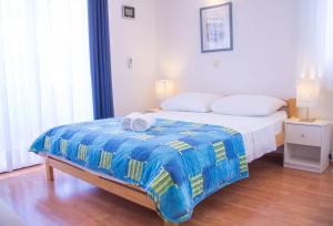 Ένα ή περισσότερα κρεβάτια σε δωμάτιο στο Villa Midea