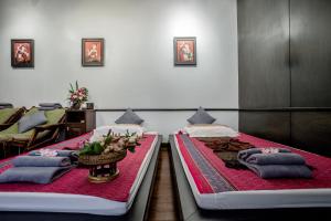 Postel nebo postele na pokoji v ubytování Aruntara Riverside Boutique Hotel