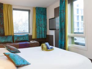 Postel nebo postele na pokoji v ubytování Ibis Styles Lyon Centre - Gare Part Dieu