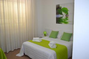 Postel nebo postele na pokoji v ubytování Bed Happy